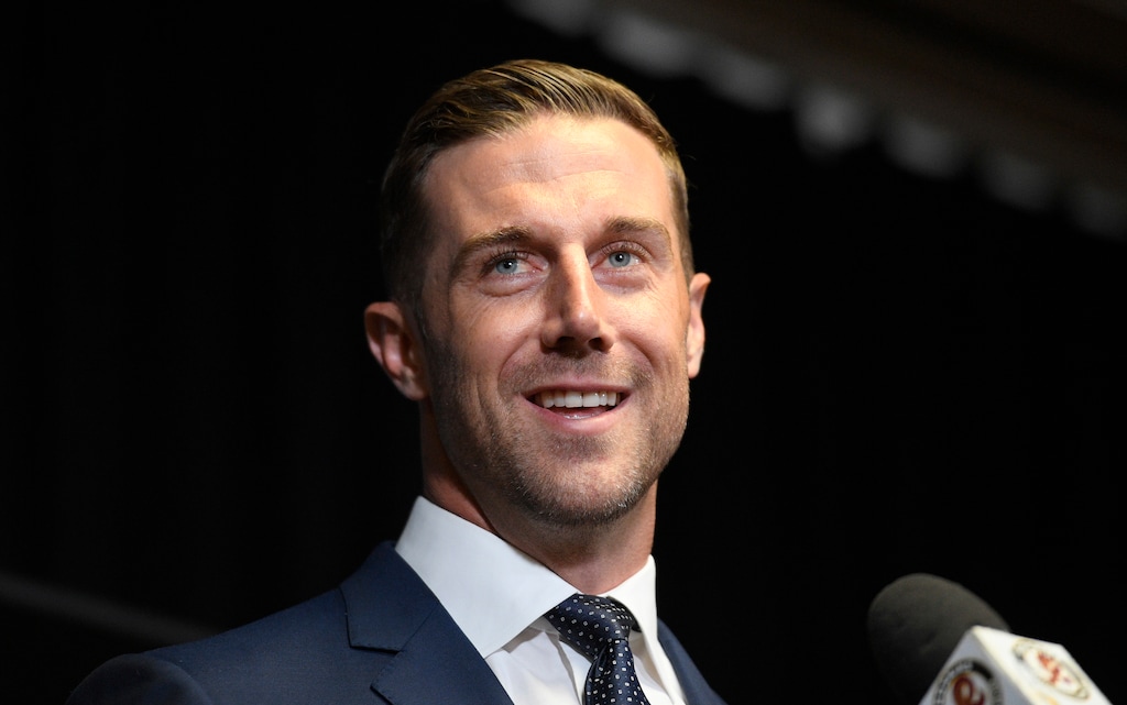 Newly signed Washington quarterback Alex Smith smiles during a news conference Thursday in Ashburn, Va. (AP Photo/Nick Wass)