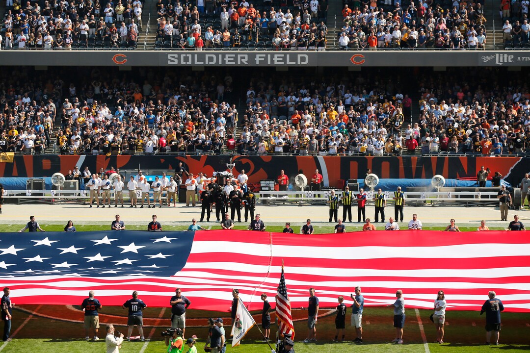 The Pittsburgh Steelers side of the field is nearly empty during the playing of the national anthem before an NFL football game between the Steelers and Chicago Bears, Sunday, Sept. 24, 2017, in Chicago. The Pittsburgh Steelers players did not come out to the field during the anthem. (AP Photo/Kiichiro Sato)