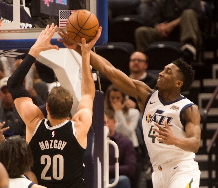 (Rick Egan  |  The Salt Lake Tribune)  Utah Jazz guard Donovan Mitchell (45) blocks a shot by Brooklyn Nets center Timofey Mozgov (20), in NBA action, Utah Jazz vs. Brooklyn Nets, in Salt Lake City, Saturday, November 11, 2017.