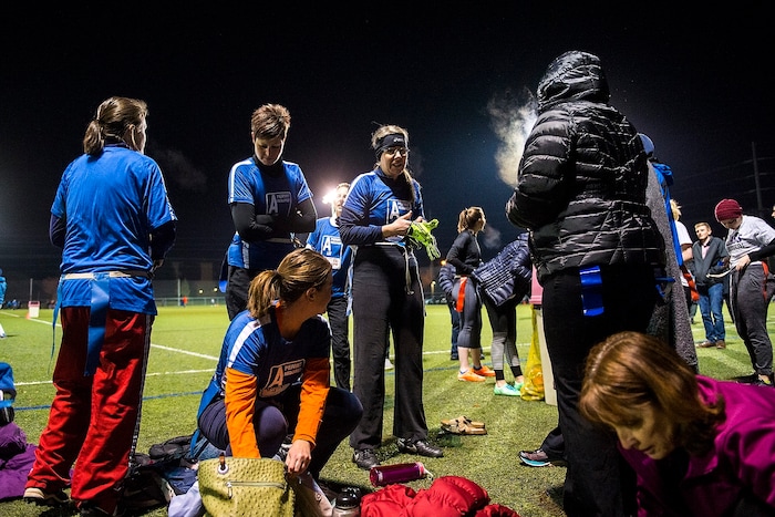 (Chris Detrick | The Salt Lake Tribune) Members of team A Lot get ready before the flag football team game against Sim Team at North University Fields in Provo Thursday, November 30, 2017.