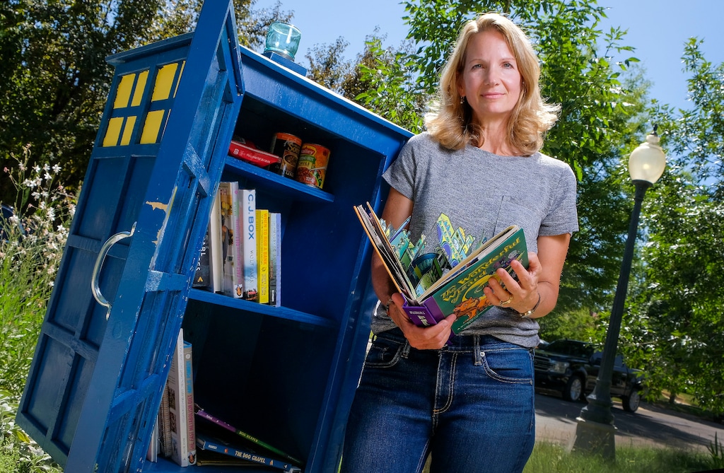 (Leah Hogsten  |  The Salt Lake Tribune)  After 32 years as an educator, Jan Roberts decided to not return to the classroom this year due to coronavirus concerns. Roberts, shown next to the family's newly constructed Little Library, fought back tears on Aug. 13, 2020, knowing that was the first day back for fellow teachers and students of Oakridge Elementary. "These are unusual times," said Roberts.