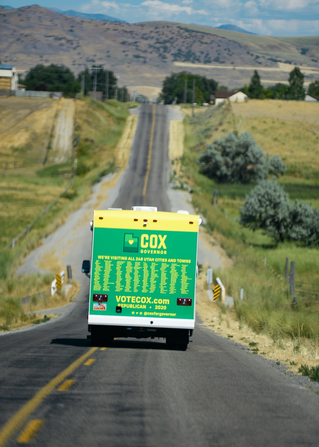 (Francisco Kjolseth  |  The Salt Lake Tribune)  Lt. Gov. Spencer Cox hits the road in his dad's RV, fresh with a campaign wrap in John Deere colors and all 248 cities and towns printed on the back as he attempts to visit each one during his gubernatorial campaign tour on Tuesday, July 30, 2019.