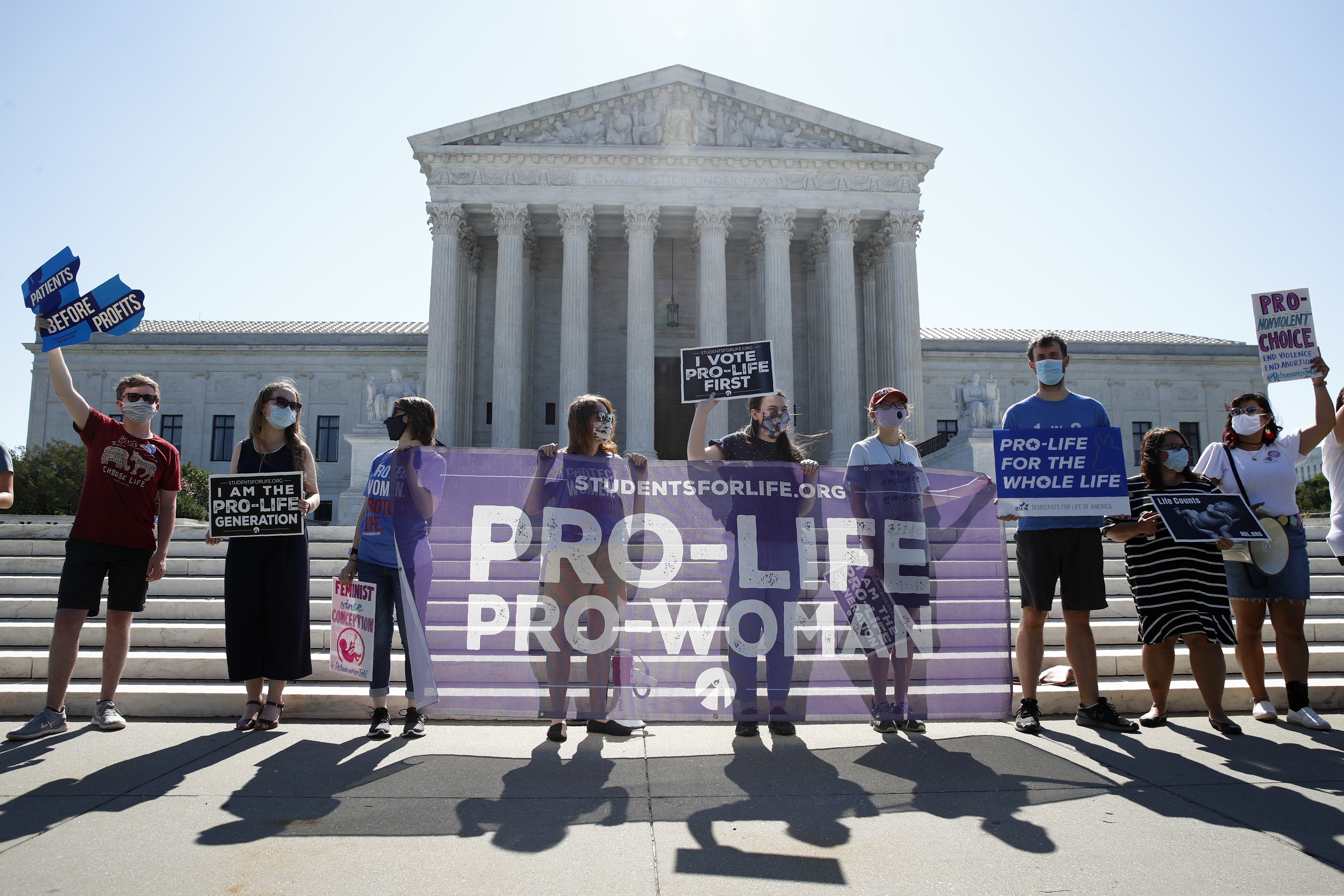 (Patrick Semansky | AP) Anti-abortion protesters wait outside the Supreme Court for a decision, Monday, June 29, 2020 in Washington on the Louisiana case, Russo v. June Medical Services LLC.