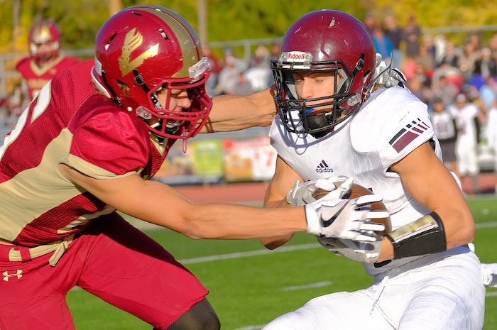 (Leah Hogsten  |  The Salt Lake Tribune) Viewmont's Cole Salmon takes down Jordan's Ethan Bolingbrooke. Jordan High School boys' football team defeated Viewmont High School 28-20 during their class 5A football playoff opener, Friday, October 27, 2017 in Bountiful.