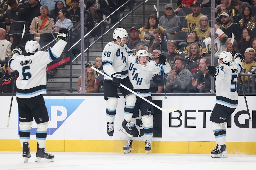 (Ian Maule | AP) Utah Mammoth defenseman Mikhail Sergachev (98) and center Logan Cooley (92) celebrate after Cooley's goal against the Vegas Golden Knights.