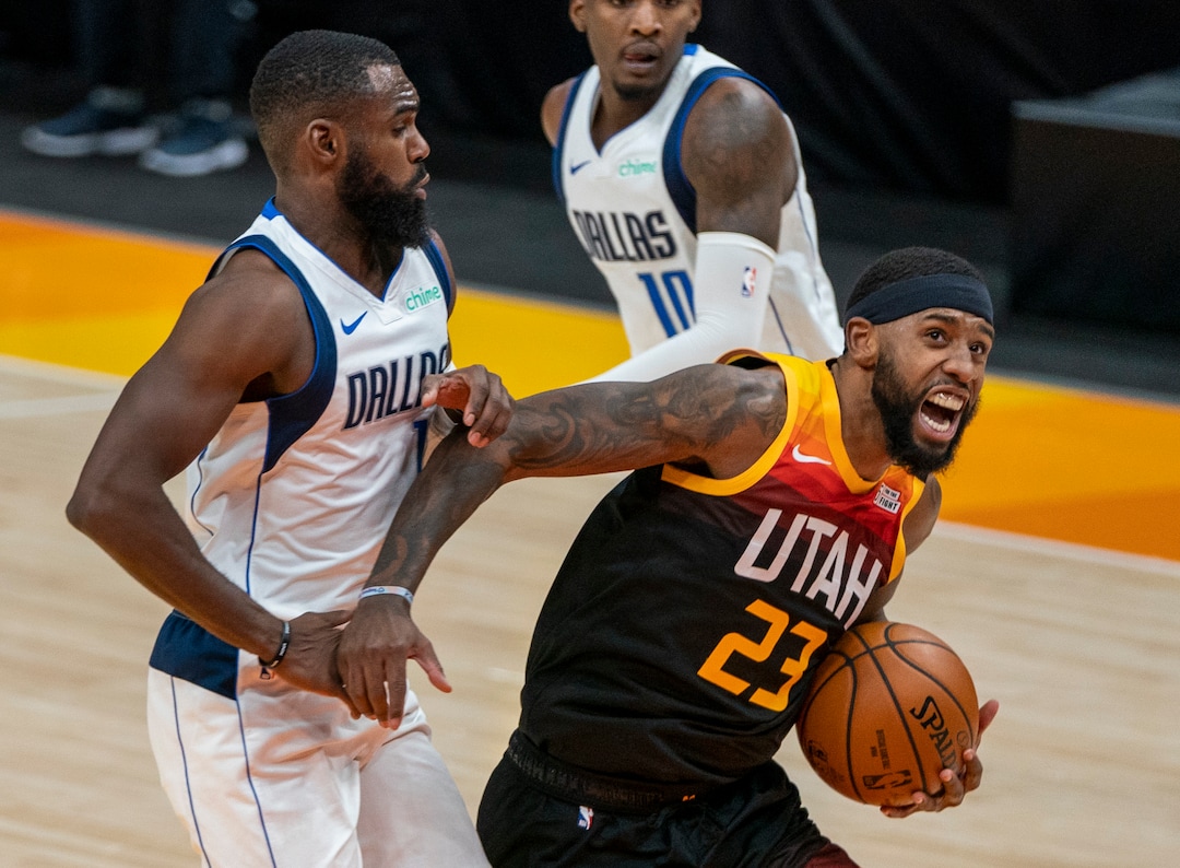(Rick Egan | The Salt Lake Tribune) Utah Jazz forward Royce O'Neale (23) takes the ball to the hoop, as Dallas Mavericks forward Tim Hardaway Jr. (11) and Dallas Mavericks guard Josh Richardson (0) defend, in NBA action between the Utah Jazz and the Dallas Mavericks at Vivint Arena, on Friday, Jan. 29, 2021.