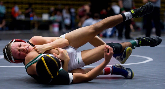 (Trent Nelson | The Salt Lake Tribune)  Davis's Parker Coffey (left) and Kearns's Antonio Aviles, 6A State Championships, high school wrestling quarterfinals in Orem, Wednesday February 7, 2018.
