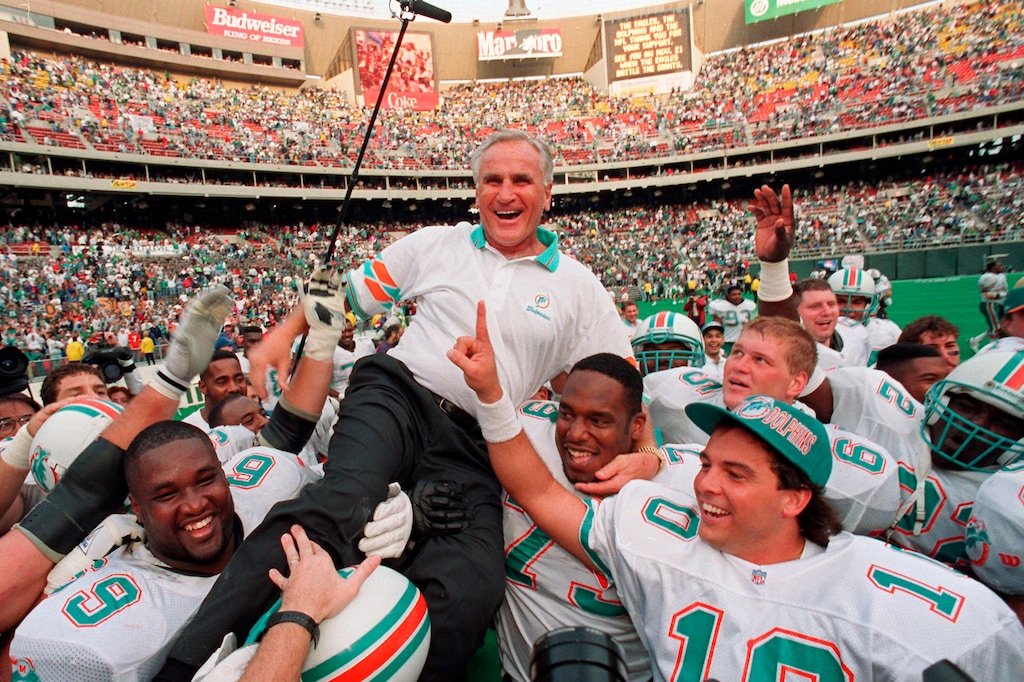 FILE - In this Nov. 14, 1993, file photo, Miami Dolphins coach Don Shula is carried on his team's shoulders after his 325th victory, against the Philadelphia Eagles in Philadelphia. Shula, who won the most games of any NFL coach and led the Miami Dolphins to the only perfect season in league history, died Monday, May 4, 2020, at his South Florida home, the team said. He was 90. (AP Photo/ George Widman)