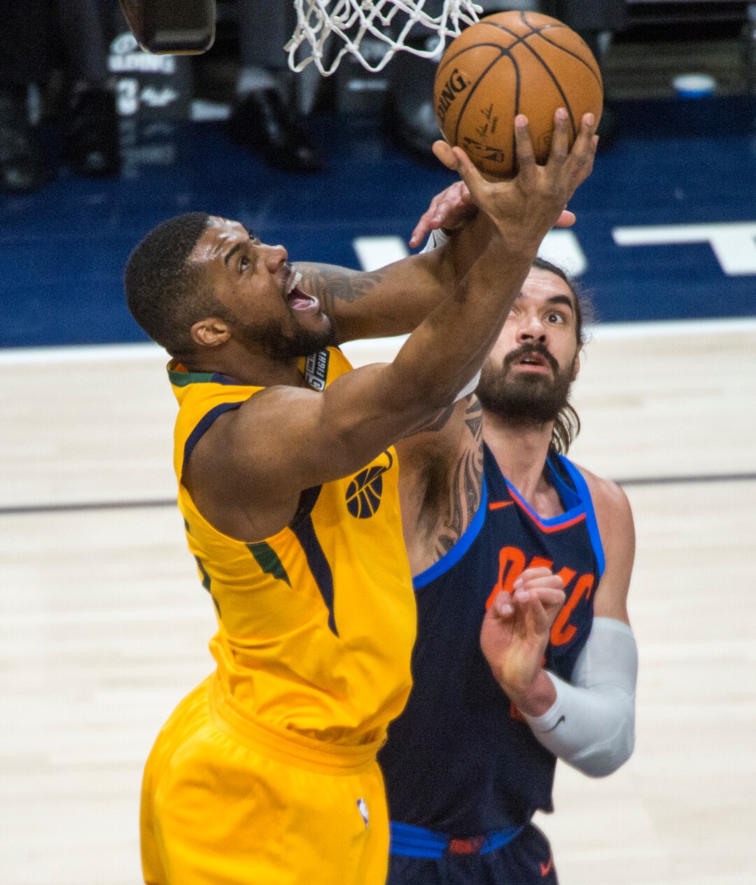 (Rick Egan  |  The Salt Lake Tribune)     Utah Jazz forward Derrick Favors (15) goes up for a shot as Oklahoma City Thunder center Steven Adams (12) defends, in NBA game 6 playoff action between Utah Jazz and Oklahoma City Thunder in Salt Lake City, Friday, April 27, 2018.