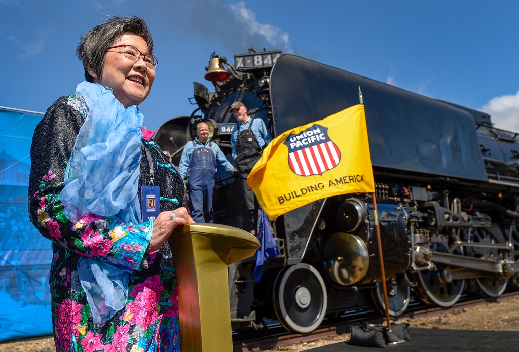 (Leah Hogsten  |  The Salt Lake Tribune)  Margaret Yee poses for pictures next to the ceremonial spike on Thursday. Yee's ancestors were among thousands of Chinese immigrants who forged the transcontinental railroad for Central Pacific. In celebration for the 150th anniversary of the transcontinental railroadÕs completion, Union Pacific's iconic steam locomotives, Living Legend No. 844 and Big Boy No. 4014 met at Ogden Union Station, May 9, 2019.