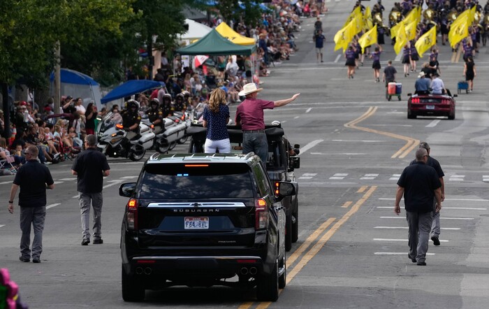 (Francisco Kjolseth | The Salt Lake Tribune) Utah Gov. Spencer Cox is joined by his wife Abby as they are joined by his security detail while participating in the Days of ’47 Parade in Salt Lake City on Saturday, July 23, 2022.