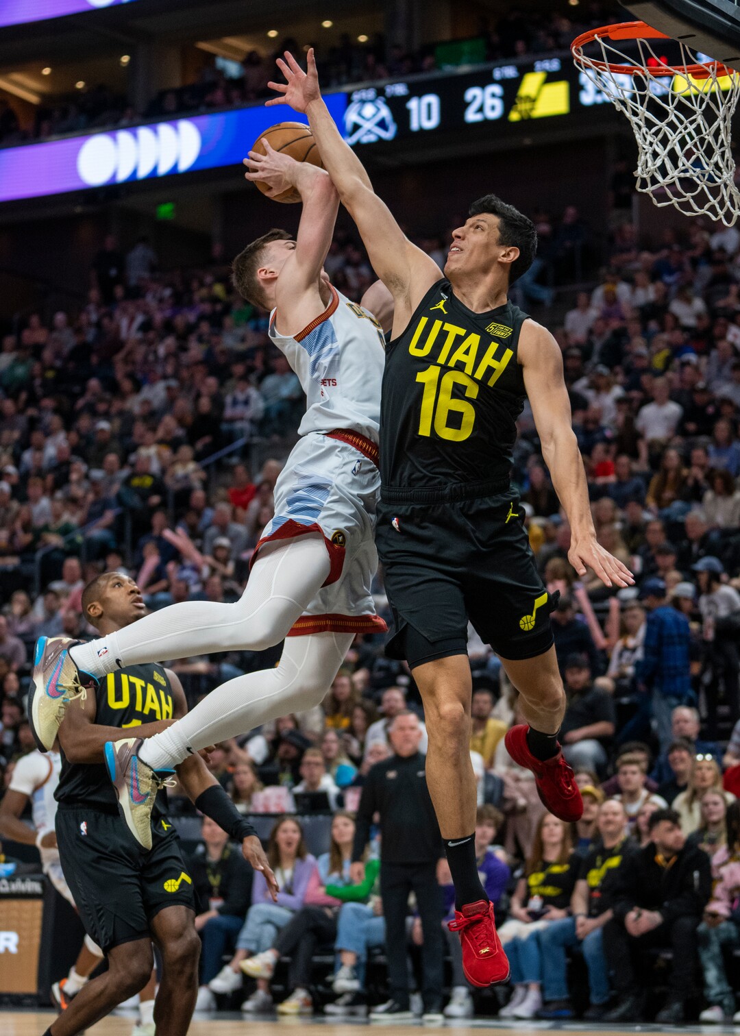 (Rick Egan | The Salt Lake Tribune) Utah Jazz forward Simone Fontecchio (16) tries to stop Denver Nuggets guard Christian Braun (0) from scoring, in NBA action between the Utah Jazz and the Denver Nuggets at Vivint Arena,  Saturday, April 8, 2023.