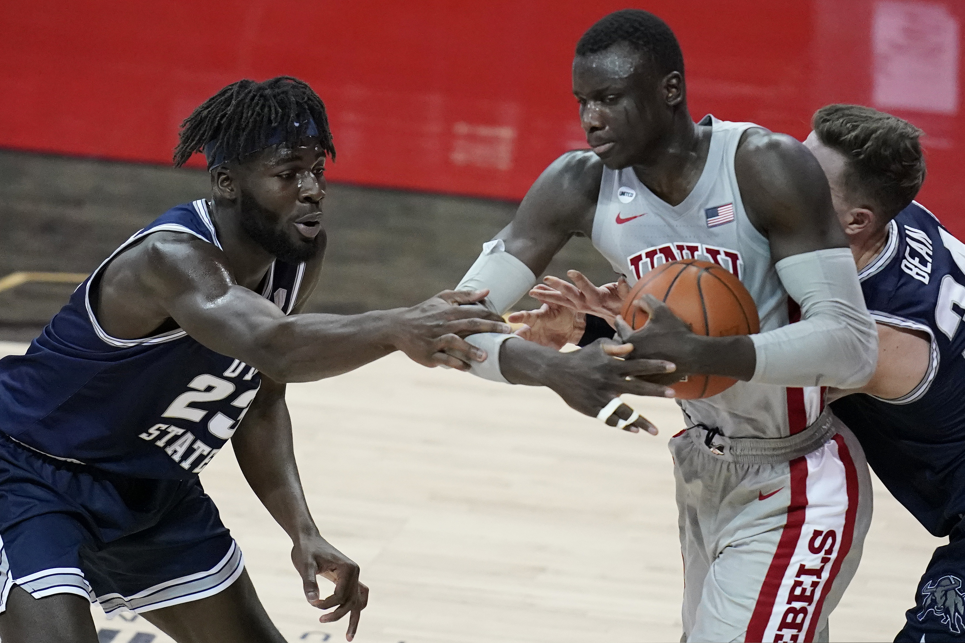 Utah State's Neemias Queta (23) competes for a rebound with UNLV's Cheikh Mbacke Diong, right, during the first half of an NCAA college basketball game Wednesday, Jan. 27, 2021, in Las Vegas. (AP Photo/John Locher)
