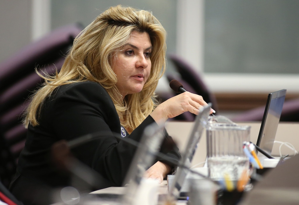 FILE - In a Monday, June 3, 2013 file photo, Nevada Assemblywoman Michelle Fiore, R-Las Vegas, works in committee during the final day of the 77th Legislative session at the Legislative Building in Carson City, Nev. Fiore spoke Wednesday, Feb. 10, 2016, to some of the four occupiers of a national wildlife refuge in Oregon. As David Fry and Sean Anderson yelled back and forth with the FBI, Fiore spoke to them and Sandy Anderson on a phone, telling them she could only help them if they stayed alive. (AP Photo/Cathleen Allison, File)