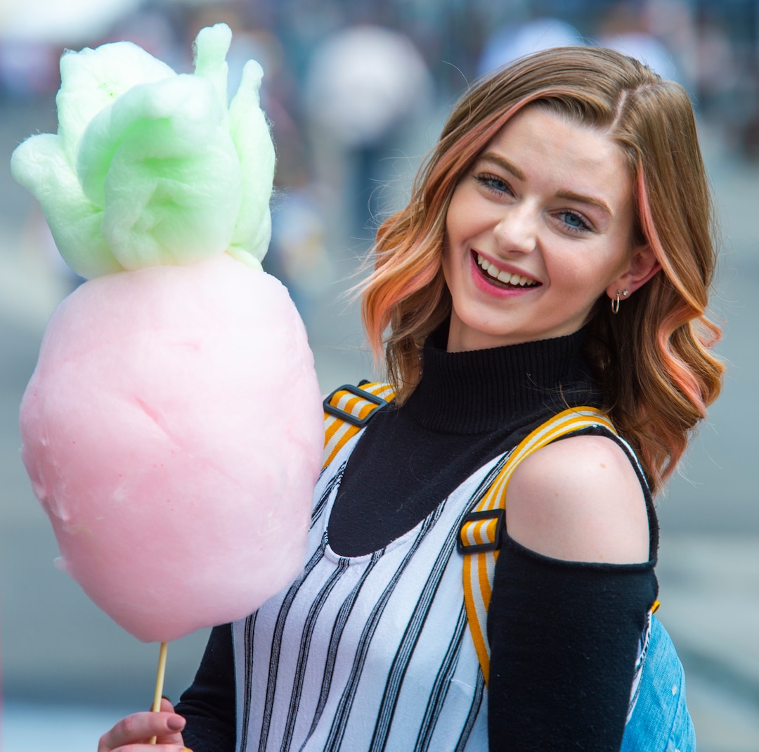 (Rick Egan  |  The Salt Lake Tribune)    ShayLee Hunter from Layton holds her cotton candy shaped like a pineapple, made by Matt Kim from Seattle hands a cotton candy shaped like a bear to a customer as he works at the Sweet Art booth at the Utah State Fair Monday, Sept. 9, 2019.