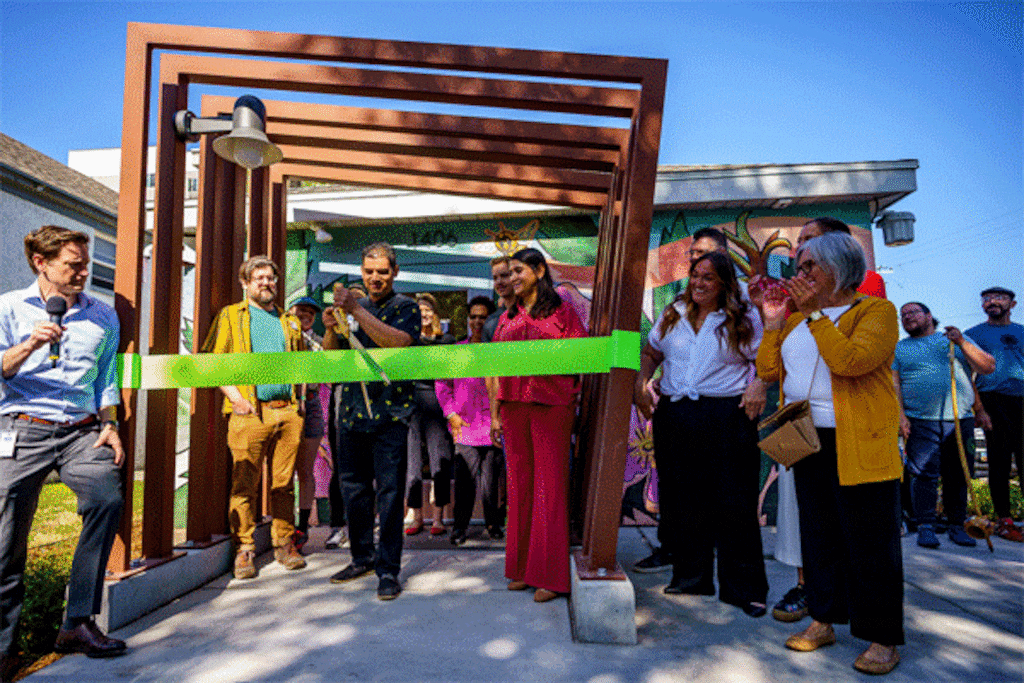 (Trent Nelson  |  The Salt Lake Tribune) Xris Macias cuts the ribbon at the opening of the Ballpark Library Lab in Salt Lake City on Friday, May 23, 2025.