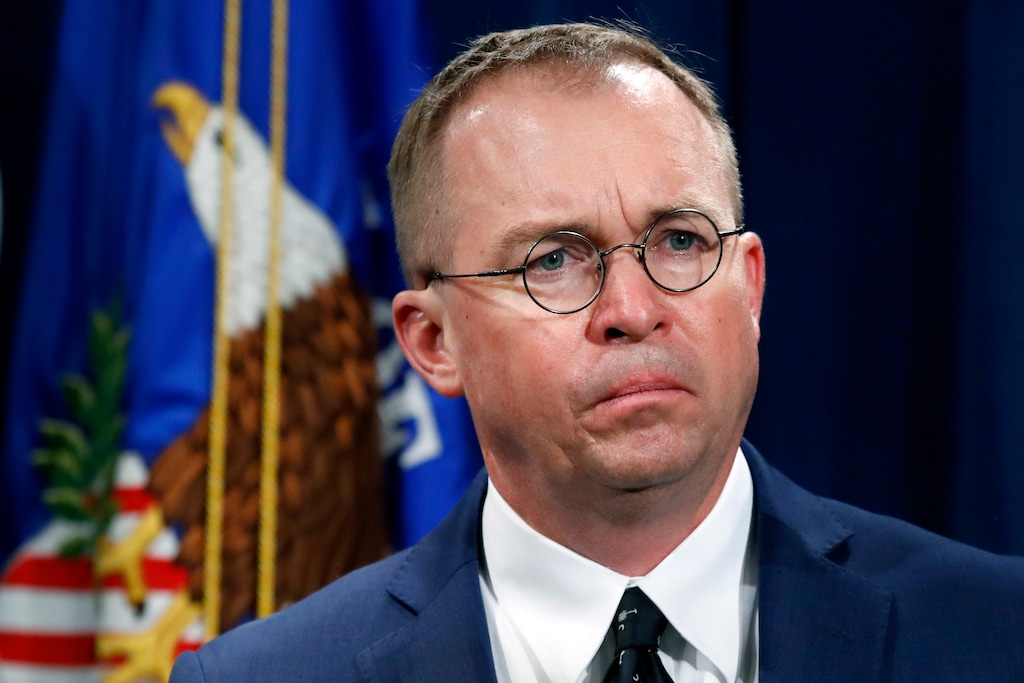 (AP Photo/Jacquelyn Martin, File) In this July 11, 2018, file photo Mick Mulvaney, acting director of the Consumer Financial Protection Bureau (CFPB), and Director of the Office of Management, listens during a news conference at the Department of Justice in Washington. Seth Frotman, the nation's top government official overseeing the $1.5 trillion student loan market resigned on Monday, citing what he says is the White House's open hostility toward protecting student loan borrowers. Frotman is the latest high-level departure from the CFPB since Mulvaney took over in late November.