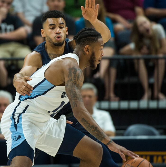 (Rick Egan  |  The Salt Lake Tribune)     Utah Jazz guard Naz Mitrou-Long (30) defends as Memphis Grizzlies guard Markel Crawford (18) drives inside, in Jazz summer league action between Utah Jazz and Memphis Grizzlies in Salt Lake City, Tuesday, July 3, 2018.
