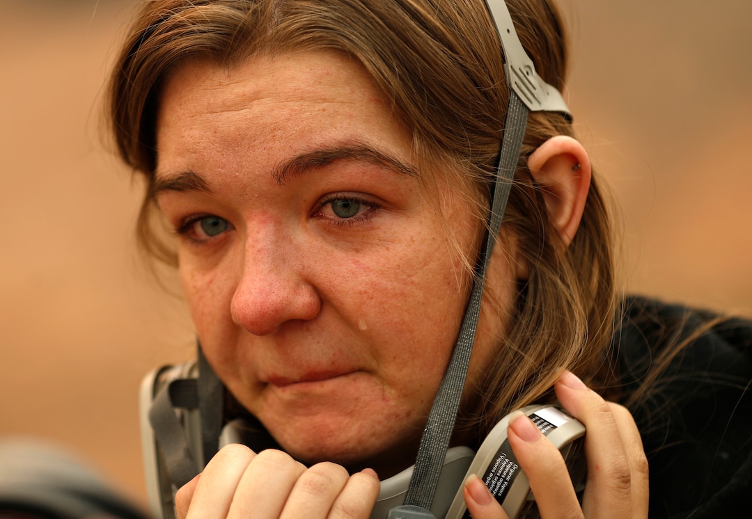 Araya Cipollini cries near the remains of her family's home burned in the Camp Fire, Saturday, Nov. 10, 2018, in Paradise, Calif.  The blaze that started Thursday outside the hilly town of Paradise has grown and destroyed more than 6,700 buildings, almost all of them homes, making it California's most destructive wildfire since record-keeping began. But crews have made gains and the fire is partially contained, officials said Saturday.  (AP Photo/John Locher)