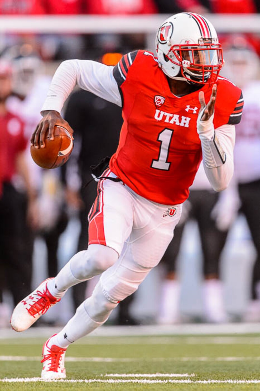 (Trent Nelson | The Salt Lake Tribune)  Utah Utes quarterback Tyler Huntley (1) runs with the ball as the University of Utah hosts Washington State, NCAA football in Salt Lake City, Saturday November 11, 2017.
