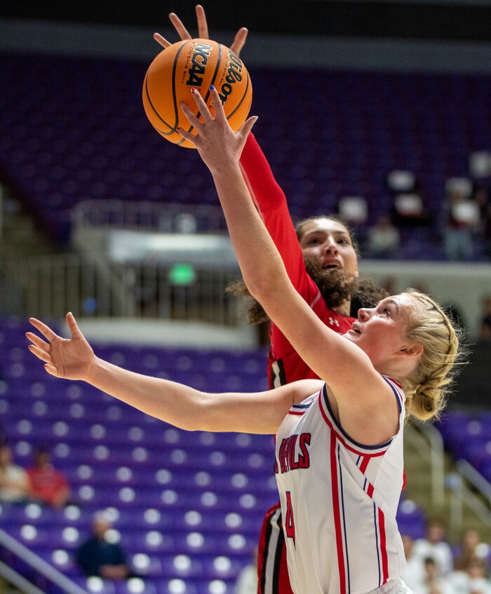 (Rick Egan | The Salt Lake Tribune) Springville Red Devil Madi Galbraith goes to the hoop, as Bountiful Redhawks Taylor Harvey defends, in the Girls 5A State Championship between the Springville Red Devils and the Bountiful Redhawks, at Weber State, on Saturday, March 4, 2023.
