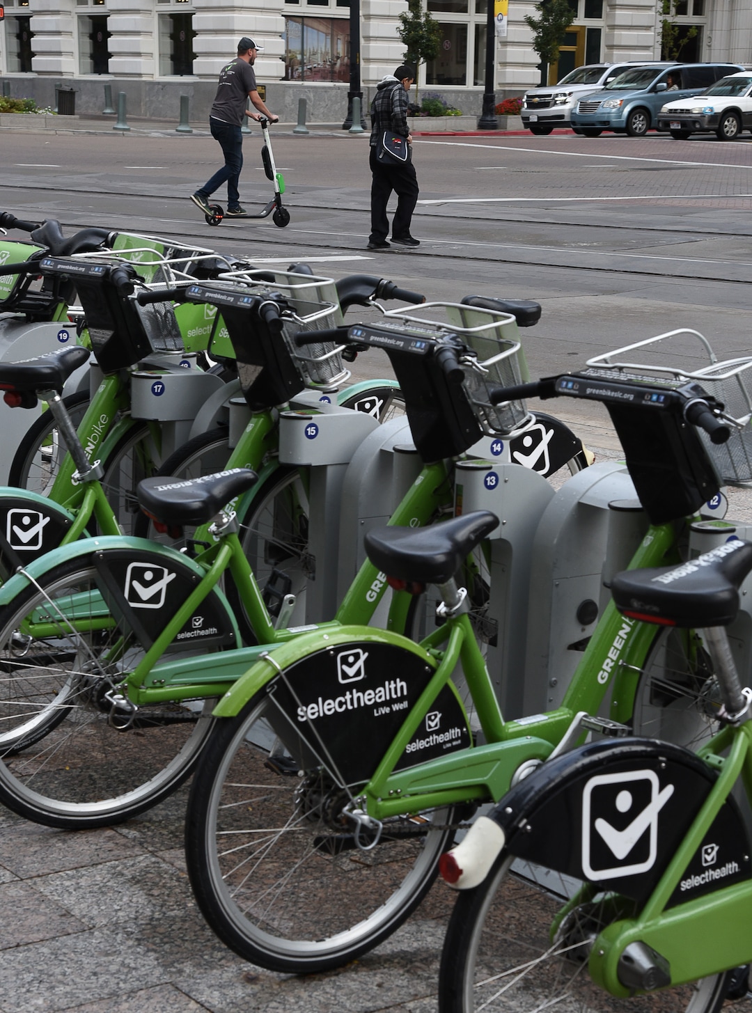 (Francisco Kjolseth  |  The Salt Lake Tribune)  An electric scooter rider scoots along in downtown Salt Lake City on Tuesday, Oct. 2, 2108. GreenBike was on track to have their best year yet but then Lime and Bird scooters derailed their momentum.