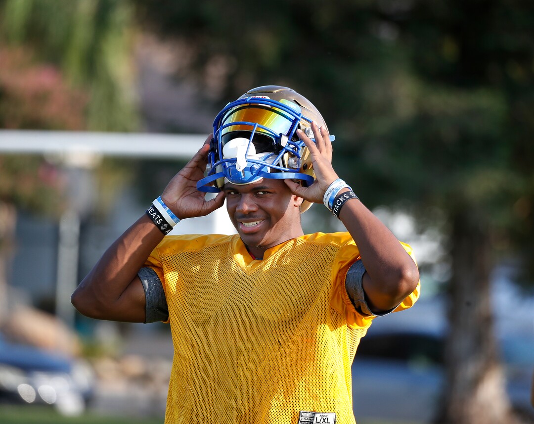 (Gary Kazanjian | Special to The Tribune) Clovis High School quarterback Nate Johnson works out with his team at Clovis High School, who committed to play for the University of Utah, shown Wednesday, July 28, 2021, in Clovis, Calif.