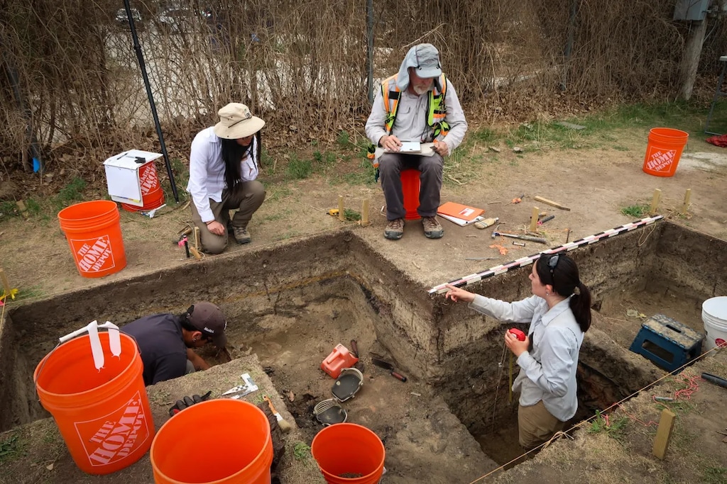(Jenna McMurtry | KHOL) Grinnell College students Jorge Salinas and Julia Ghorai are deep in the trenches of the Rock Springs dig site. Professor Laura Ng and assisting archaeologist Paul Hoornbeek advise from above, in what could be the last dig at the site, given the dwindling federal support for archaeology.