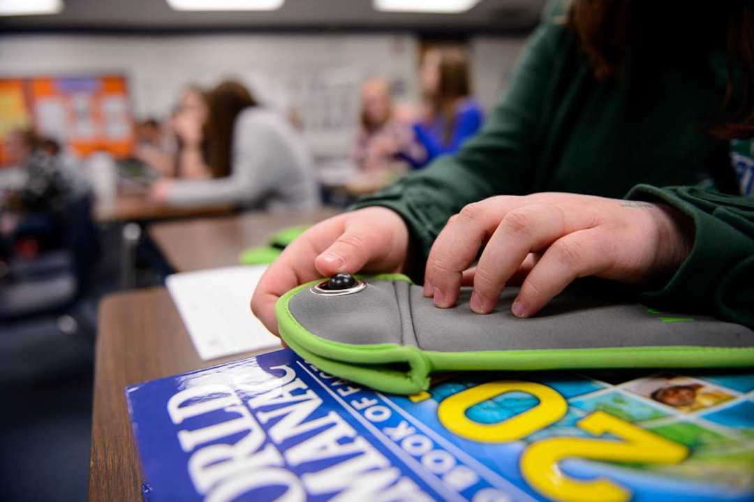 (Trent Nelson | The Salt Lake Tribune) Students in Monta Thomas' classes at Brighton High School in Cottonwood Heights secure their phones in locking pouches made by Yondr.
