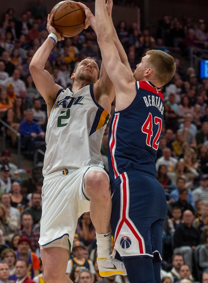 (Rick Egan  |  The Salt Lake Tribune)     Utah Jazz guard Joe Ingles (2) shoots as Washington Wizards forward Davis Bertans (42) defends, in NBA action between the Utah Jazz and the Washington Wizards, in Salt Lake City, Friday, February 28, 2020