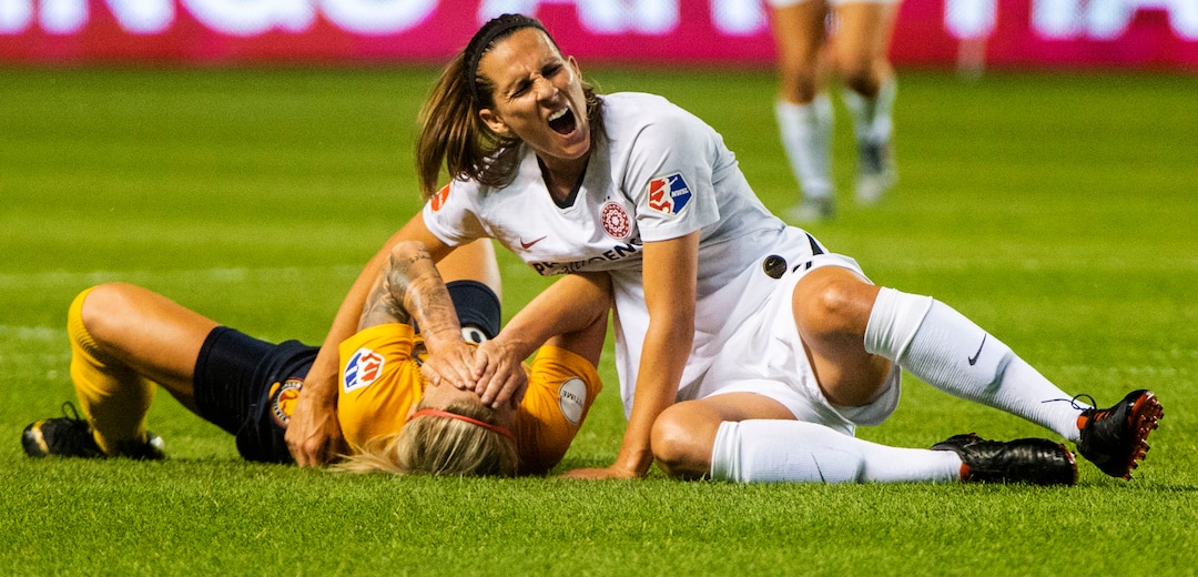 (Rick Egan  |  The Salt Lake Tribune)    Utah Royals FC midfielder Gunnhildur Jónsdóttir (66) collides with Portland Thorns FC defender Katherine Reynolds (2), in Soccer action between Utah Royals FC and Portland Thorns FC, in Sandy, Friday, July 19, 2019.