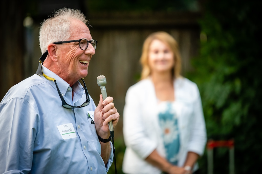 (Jesse Walker) The Tribune's Tim Fitzpatrick, a Utah State University graduate, speaks during a fundraiser for Utah Public Radio and The Tribune in Logan on Aug. 14, 2022. UPR co-manager Kerry Bringhurst looks on.