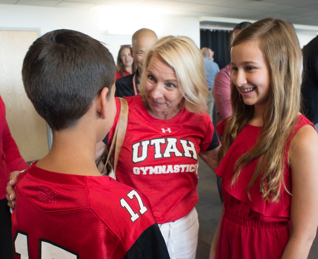 (Rick Egan  |  The Salt Lake Tribune)   Megan Marsden Utah's Co-Head Gymnastics Coach chats with University of Utah's new Athletic Director, Mark Harlan's, children, Austin and Savannah, after a news conference at the Rice-Eccles Stadium,  Monday, June 4, 2018.