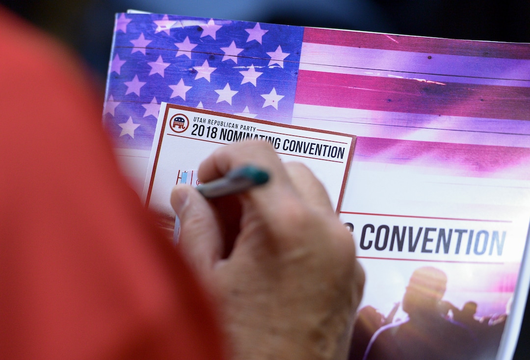 (Leah Hogsten  |  The Salt Lake Tribune) A state delegate casts his ballot at the Utah Republican Nominating Convention Friday, April 20, 2018 at the Maverick Center. 