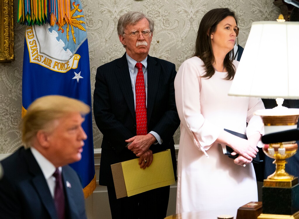 (Doug Mills | The New York Times) John Bolton, then the national security adviser, looks on as President Donald Trump meets with Prime Minister Viktor Orbán of Hungary at the White House in Washington, May 13, 2019. In his new book, Bolton describes episodes where the president sought to halt criminal inquiries. He also says Trump’s loyalists mocked him behind his back.