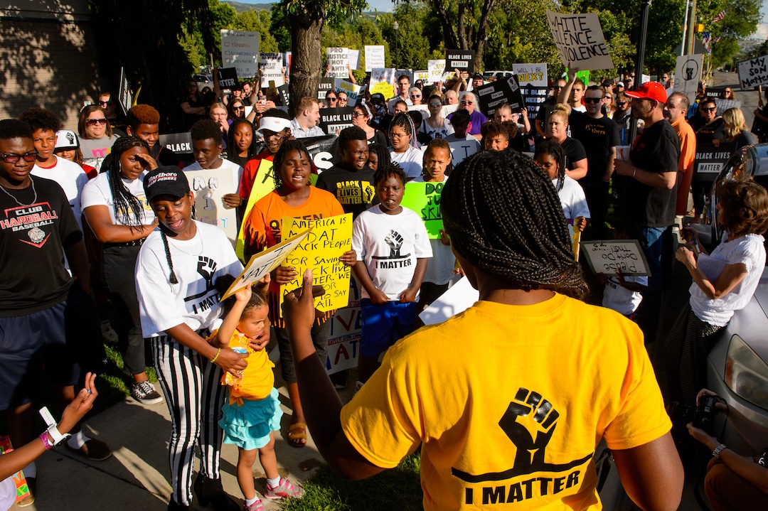 (Trent Nelson  |  The Salt Lake Tribune)Josianne Petit speaks at a protest organized by Black Lives Matter and other groups at the Woods Cross Police Department on Friday June 14, 2019. The rally was to show support for DJ Hrubes, a 10-year-old black child who was held at gunpoint by a police officer last week while playing in his grandmother's front yard.