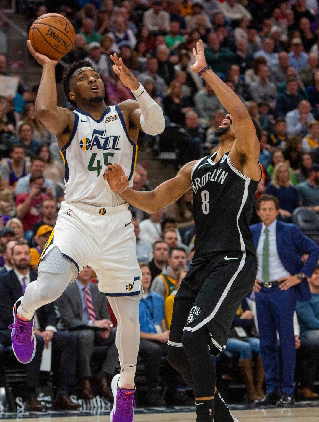 (Rick Egan  |  The Salt Lake Tribune)        Utah Jazz guard Donovan Mitchell (45) shoots as Brooklyn Nets guard Spencer Dinwiddie (8) defends, in NBA basketball action between the Utah Jazz and the Brooklyn Nets in Salt Lake City, Tuesday, Nov 12, 2019.