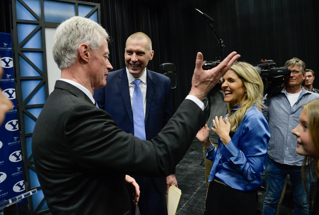(Francisco Kjolseth  |  The Salt Lake Tribune)  Mark Pope, center, alongside his wife Lee Anne speaks with BYU president Kevin Worthen after being introduced as its new head basketball coach during a press event at the BYU broadcasting building on Wed. April 10, 2019.