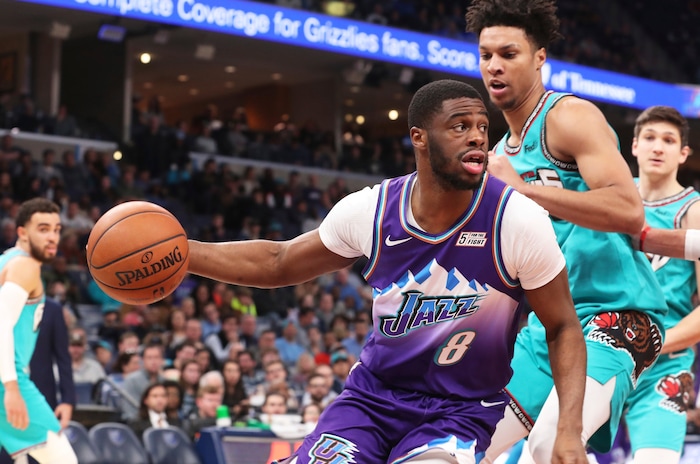 Utah Jazz guard Emmanuel Mudiay (8) looks to pass as Memphis Grizzlies forward Brandon Clarke (15) approaches in the second half of an NBA basketball game Friday, Nov. 29, 2019, in Memphis, Tenn. (AP Photo/Karen Pulfer Focht)