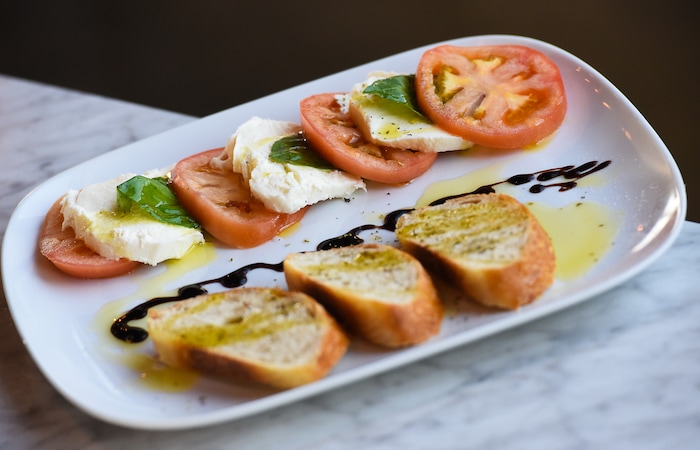 (Francisco Kjolseth | The Salt Lake Tribune) Caprese salad with fresh in house made paesano bread from Terra Mia Italian restaurant in Draper, a sister restaurant to Terra Mia in Orem.