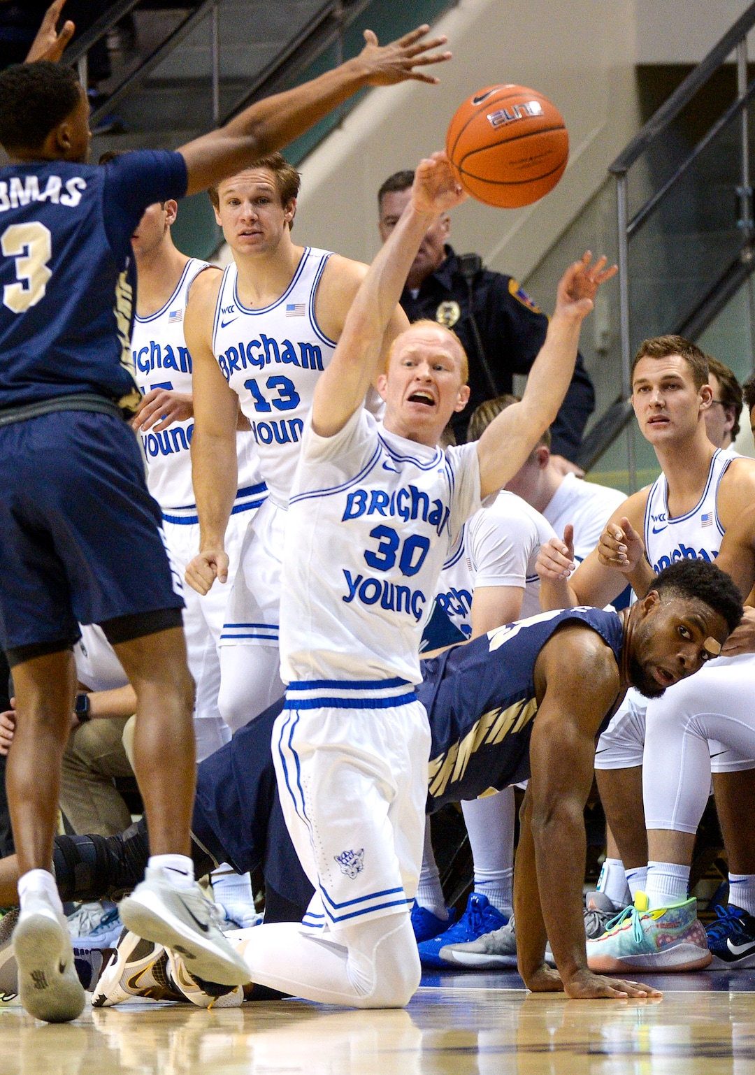 (Leah Hogsten  |  The Salt Lake Tribune) Brigham Young Cougars guard TJ Haws (30) grabs the loose ball as Brigham Young University hosts Oral Roberts, Dec. 28, 2019 at the Marriott Center in Provo.