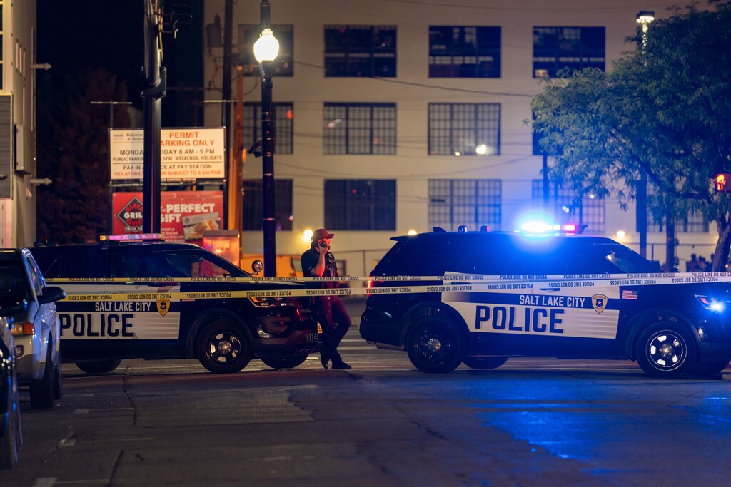 (Salt Lake City Police Department) Salt Lake City police vehicles block the street as officers serve a search warrant at the New Yorker Social Club, at 60 W. Market St., on Aug. 26, 2023.
