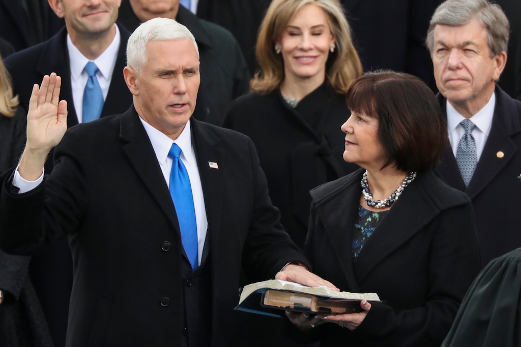 (AP Photo/Andrew Harnik) In this Jan. 20, 2017 file photo, Karen Pence holds a Bible as her husband, Vice President Mike Pence is sworn in during the 58th Presidential Inauguration at the U.S. Capitol in Washington. Chris Stroop, a writer and activist, introduced the #ExposeChristianSchools category on Twitter in January 2019 shortly after news broke that Karen Pence would be teaching at a Christian school in northern Virginia that lists "homosexual or lesbian sexual activity" as among the disqualifying criteria for prospective employees.