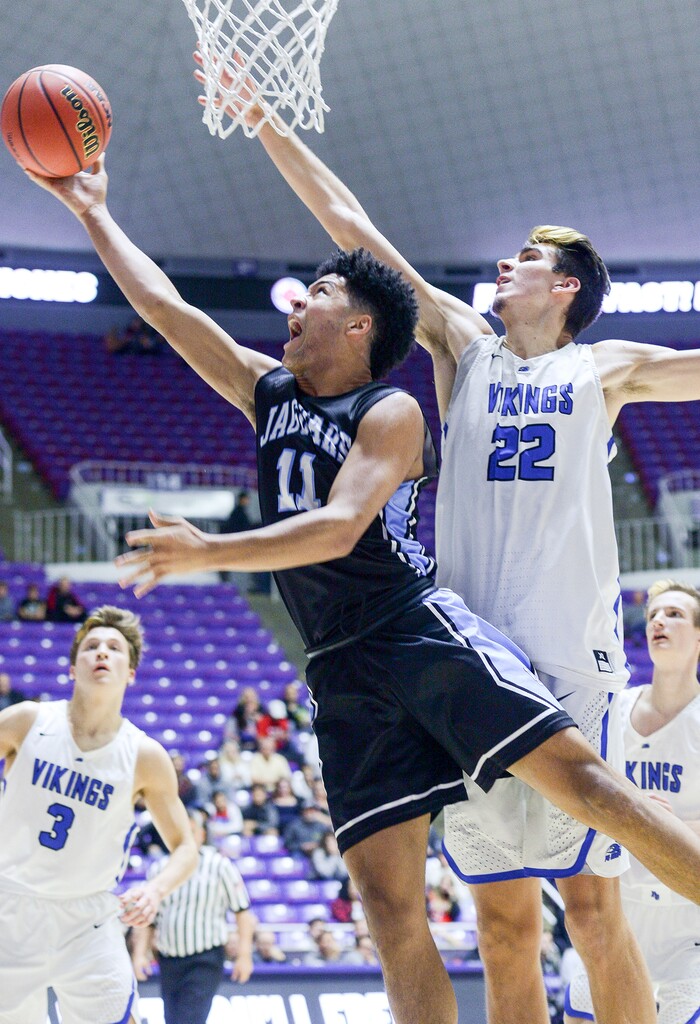(Leah Hogsten  |  The Salt Lake Tribune) West Jordan's Darrian Nebeker (11) fights Pleasant Grove's Matt Van Komen (22) to get to the net. Pleasant Grove defeated West Jordan 62-54 in the 6A High School Boys' Basketball Tournament opening game at Weber State University’s Dee Events Center in Ogden,  Tuesday, Feb. 27, 2018. 