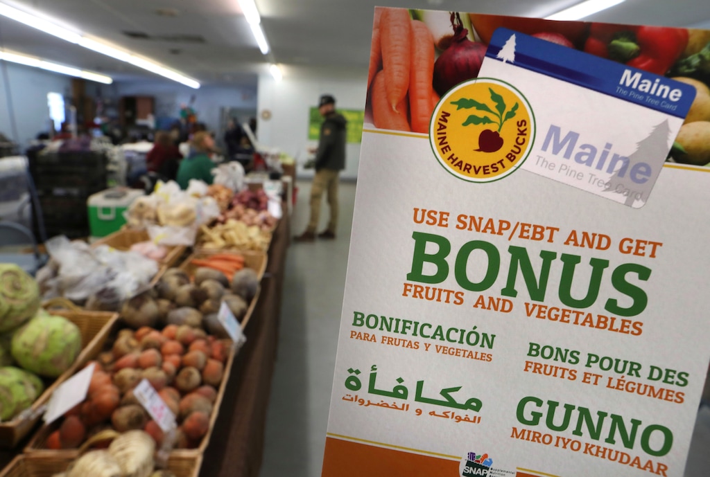 In this Friday, March 17, 2017 photo a sign advertises a program that allows food stamp recipients to use their EBT cards to shop at a farmer's market in Topsham, Maine. Republican governor Paul LePage and several Republican legislators nationwide say they hope that Republican President Donald Trump will support banning food stamps to purchase junk food like soda. (AP Photo/Robert F. Bukaty)
