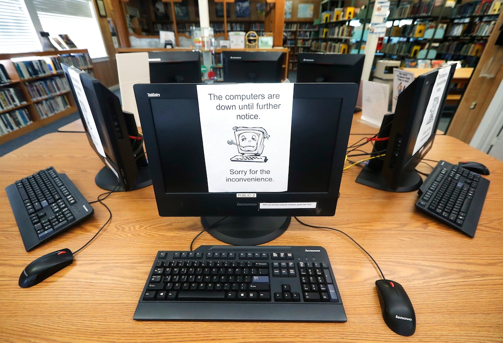 (Tony Gutierrez | The Associated Press) Signs on a bank of computers tell visitors that the machines are not working at the public library in Wilmer, Texas, Thursday, Aug. 22, 2019. Cyberattacks that recently crippled nearly two dozen Texas cities have put other local governments on guard.
