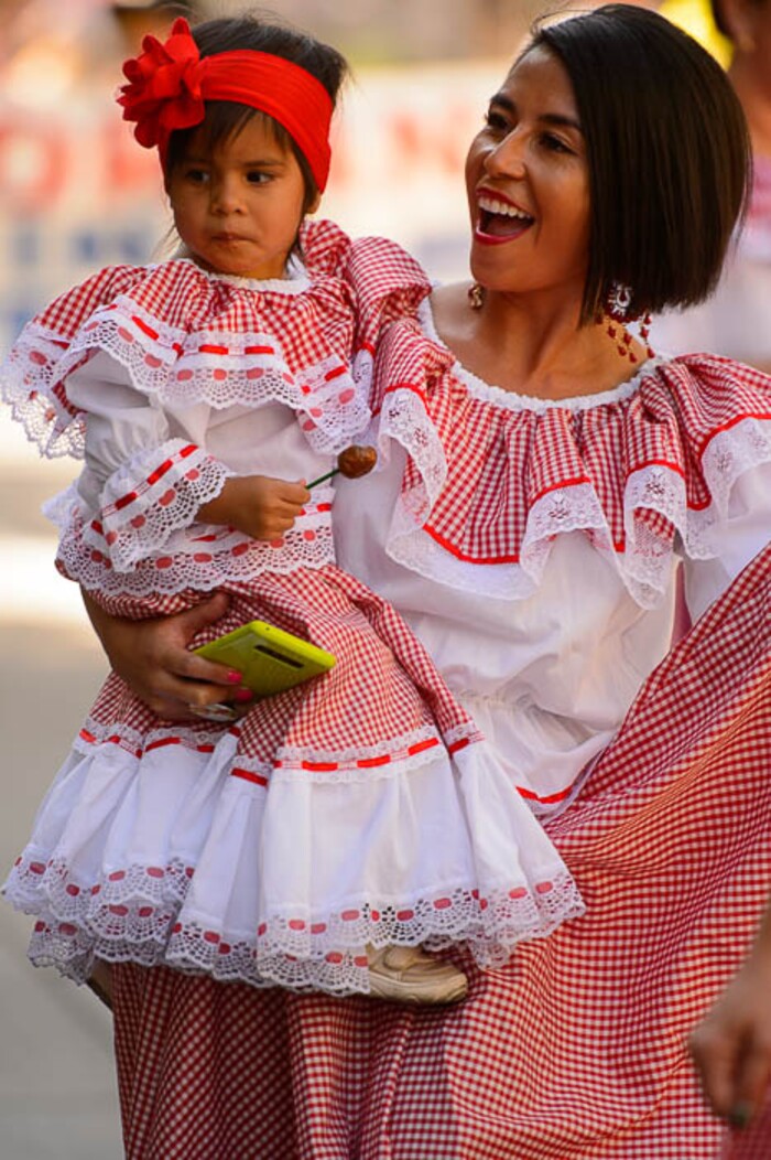 (Trent Nelson | The Salt Lake Tribune)
Diana Moscoso-Caudell carrying Nyra Caudell in the third annual Hispanic Heritage Parade and Street Festival in Salt Lake City, Saturday Sept. 22, 2018.
