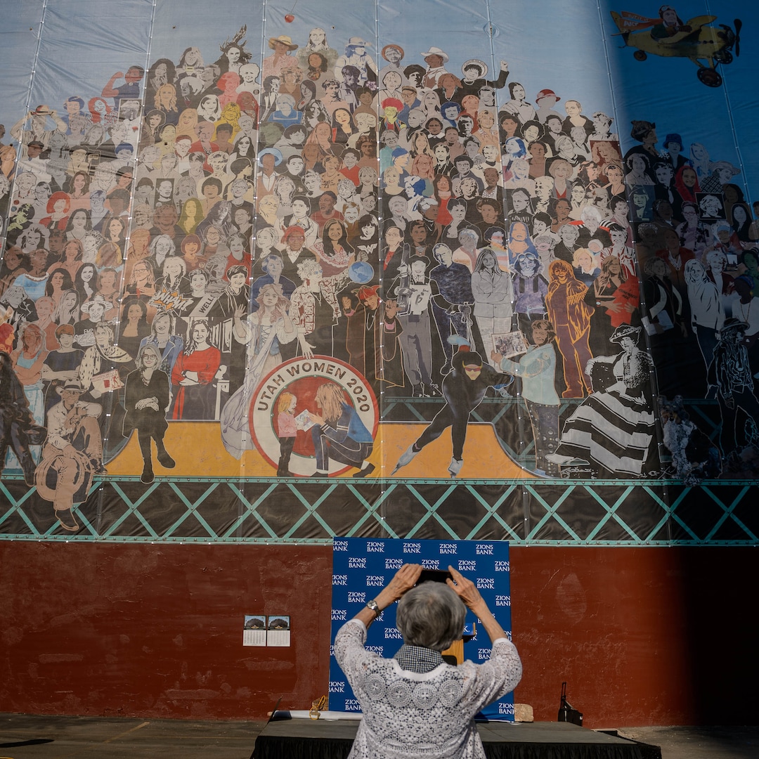 (Trent Nelson  |  The Salt Lake Tribune) Pamela Atkinson takes a photograph of the new "Utah Women 2020" mural, featuring more than 200 Utah women from the past and present, including Atkinson, on the Dinwoody Building in Salt Lake City on Wednesday, Aug. 26, 2020.