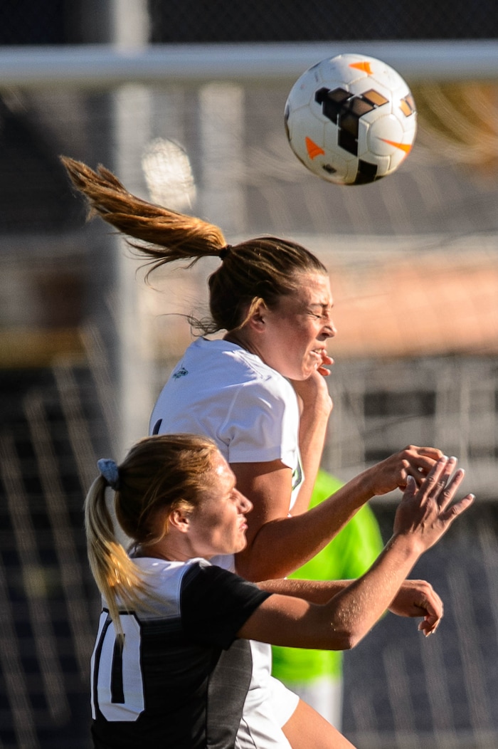 (Trent Nelson | The Salt Lake Tribune)  Syracuse's Kelsey Steed and Pleasant Grove's Bree Carson in the Class 6A girls' soccer state quarterfinal between Pleasant Grove and Syracuse, in Syracuse Thursday October 12, 2017.