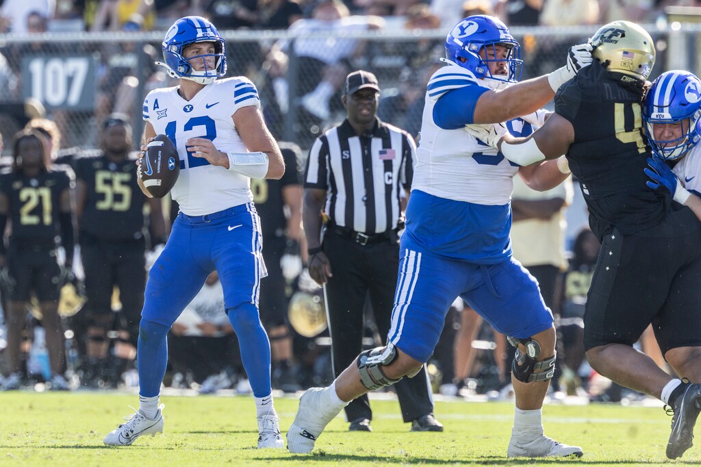 BYU quarterback Jake Retzlaff drops back into pocket against Central Florida during the first half of an NCAA college football game, Saturday, Oct. 26, 2024, in Orlando, Fla. (AP Photo/Kevin Kolczynski)